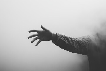 Fototapeta premium A Hand Reaching Out from the Mist