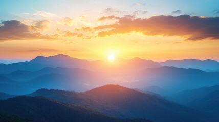 Obraz premium Stunning landscape of mountains at sunrise, showcasing vibrant colors and serene beauty in a tranquil outdoor setting.