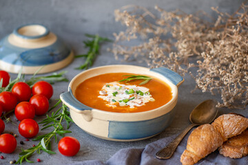 Tomato soup on grey background