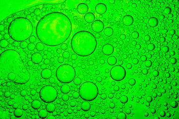 Green macro science bubble texture,green oil drops on a water surface abstract background,Abstract background of soap bubbles on gradient background