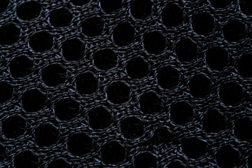 Black macro sports fabric texture,Cloth texture. Sport background,A close up of a black mesh fabric