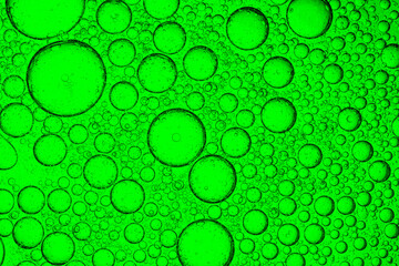 Green macro science bubble texture,green oil drops on a water surface abstract background,Abstract...