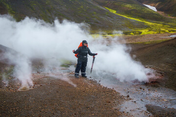 Woman hiker in geothermal area of Iceland