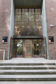 Entrance to the Univeristy of London School Of Pharmacy with decorative doors and glass atrium windows. London, UK 08 27 2024 