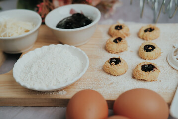 Description
Blueberry cheese cookies, eggs, butter and flour on a white table, cooking, baking. Top view
