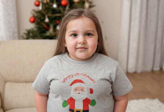Girl, age 10, excited but whiny, waiting for Christmas presents, complaining on the couch.