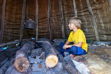 Family with children and pet dog, visiting Nordkapp during the summer holiday