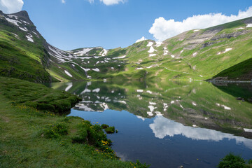 Bachalpsee Lake in Grindelwald Switzerland, reached from a hike at Grindelwald First in the Swiss Alps