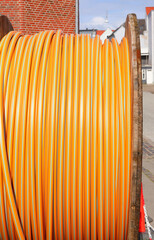 orange reel for laying optical fiber for very high speed internet connections