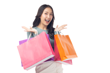 Cheerful young woman holding colorful shopping bags in both hands, expressing joy and excitement. Set against a clean white background, her enthusiasm captures the fun of a successful shopping spree