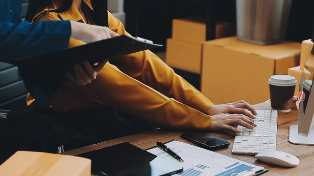 Small businesses SME owners female entrepreneurs check online orders to prepare to pack the boxes, sell to customers, sme business ideas online
