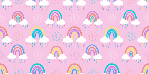 .Abstract rainbow with clouds and raindrops, doodles and circles in a seamless pattern. Childrens pattern in muted pastel colors. Hand-drawn illustration