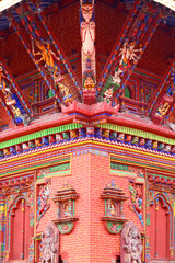 Changu Narayan Temple close-up showcasing intricate wooden carvings, colorful deities, and traditional Nepali architectural details. The oldest temple of Nepal.