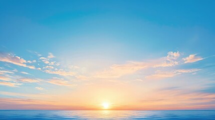 Obraz premium A serene sunrise over a tranquil ocean, casting soft hues of orange and pink across a clear blue sky.