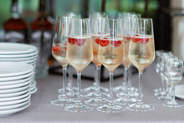 glasses champagne, welcome drink, wine glass, cocktail, with raspberry, Sparkling wine,celebrate a luxury party, Catering, party service,