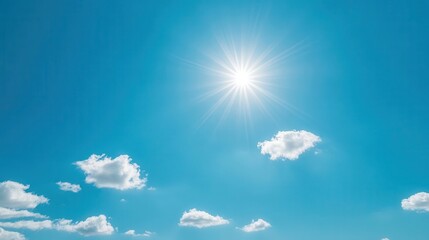 Clear blue sky with a few white clouds, serene weather, bright sunlight