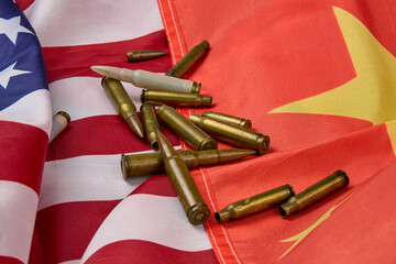 American and Chinese flags with rifle bullets scattered.