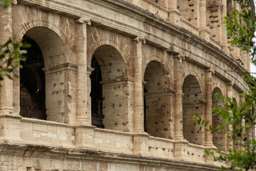 Obraz premium Roman Colosseum, the largest ancient amphitheatre ever built, Italy. Arches, exterior facade. Giardinetto del Monte Oppio. Rome, Italy
