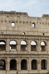 Obraz premium Roman Colosseum, the largest ancient amphitheatre ever built, Italy. Arches, exterior facade. Giardinetto del Monte Oppio. Rome, Italy