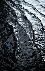 Close-up of gentle water ripples creating an abstract texture on the surface, reflecting light and shadows beautifully.