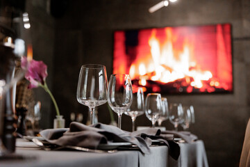 Served tables, decorated banquet, glasses champagne, luxury elegant table, pleasant dinner atmosphere, Celebration and party concept, concept of rest, Sparkling wine,