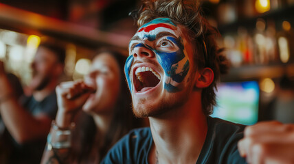 A young sports fan with a painted face, intensely focused on a sports match playing on a pub TV, surrounded by friends cheering and enjoying the atmosphere. Ai generated