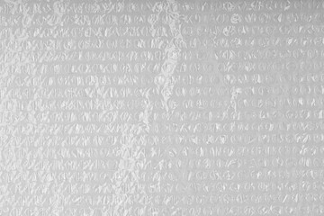 Close up of a sheet of plastic bubble wrap texture for background. Plastic material with air for packaging.