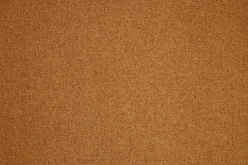 Close-up of ochre fabric background. Designer concept.