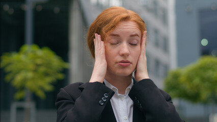 Close up unhappy tired young Caucasian ginger woman gen z businesswoman girl female student formal...