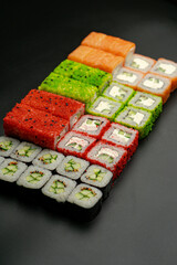 Set of sushi rolls on a black background