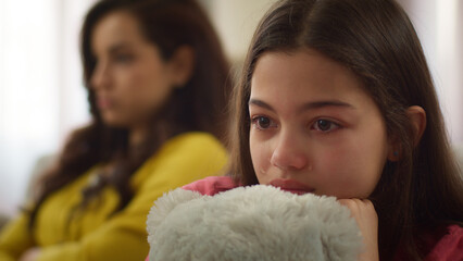 Family abuse conflict close up sad crying Caucasian little girl child kid daughter cry sitting with...
