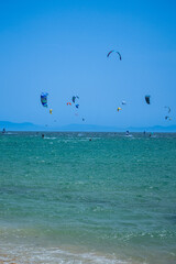 Enjoying kitesurfing on Valdevaqueros beach, Gibraltar Strait in Tarifa, Spain