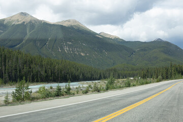 Mountain Highway Along River with Forest View