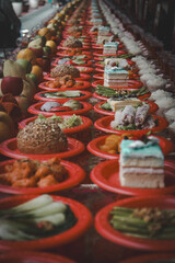 Many dishes of food are repeated ad infinitum in a Buddhist temple