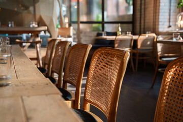 The aesthetic COZY appearance of an empty cafe with wooden furniture and minimalism.