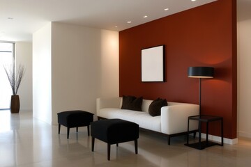 Fototapeta premium A contemporary living room featuring a white sofa with black pillows, two black ottomans, and a floor lamp against a bold red accent wall. The space is bright and airy with a minimalist aesthetic.