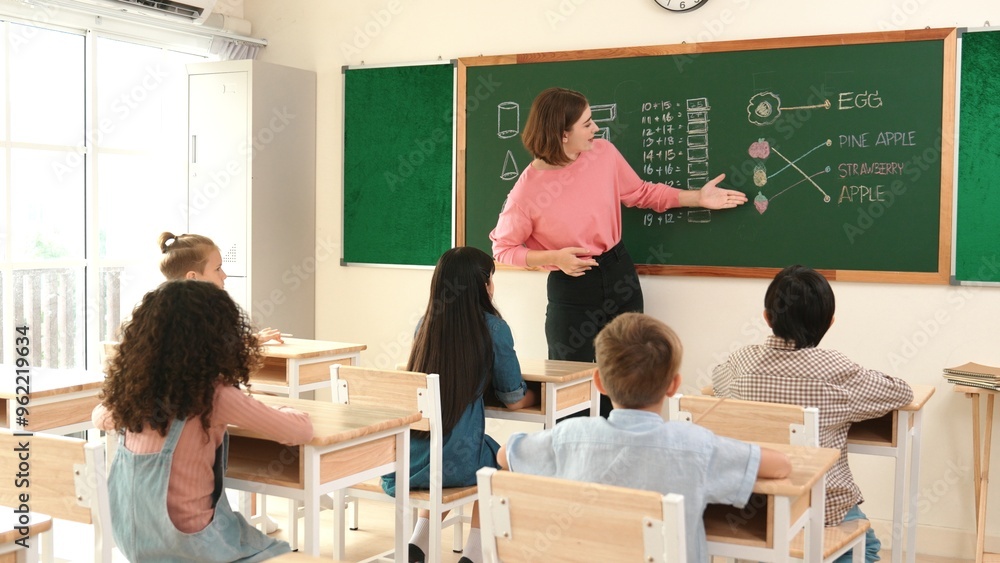 Poster smart teacher checking cute student homework while explaining idea at class. attractive instructor w