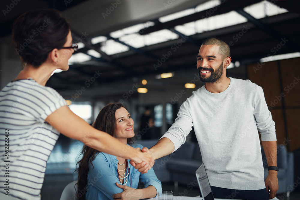 Wall mural Deal, handshake and partnership with business people in office together for agreement or contract. Smile, thank you or welcome with employee man and woman shaking hands in creative workplace