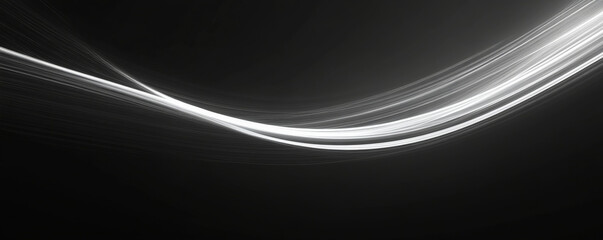 A minimalist design featuring thin white light trails dancing across a black background, creating simple yet striking curves.