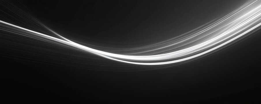 A minimalist design featuring thin white light trails dancing across a black background, creating simple yet striking curves.
