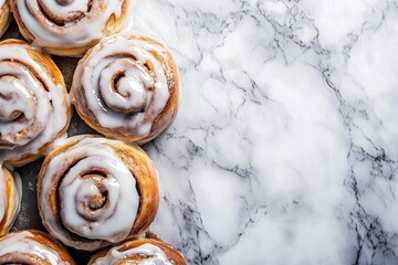 Cinnamon rolls freshly baked with copyspace, icing drizzled on top.