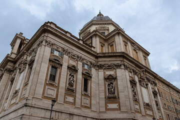 The image showcases the majestic facade of Basilica di Santa Maria Maggiore in Rome, Italy, highlighting its impressive architecture and intricate details.