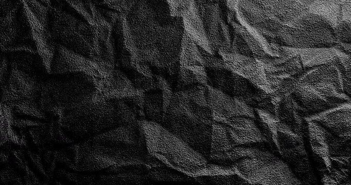 Crumpled rough dark surface. Black crumpled texture surface.
