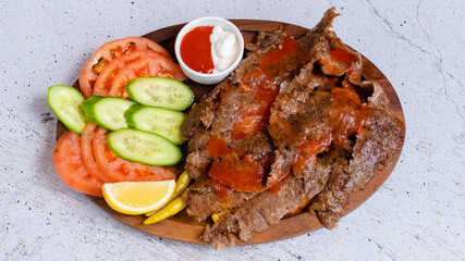 Delicious porion doner kebab with fries and vegetables