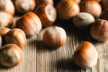Hazelnuts on a wooden surface, organic natural food, nuts macro, food background.