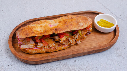 Delicious doner kebab on wooden tray
