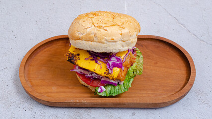 Delicious burger on wooden tray