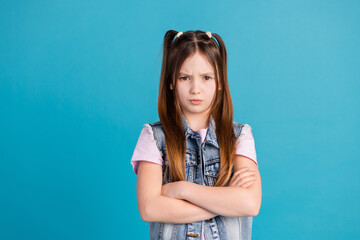 Photo portrait of adorable small girl crossed hands irritated dressed stylish denim garment isolated on blue color background