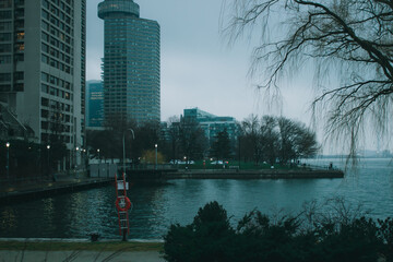 Fototapeta premium Moody Urban Waterfront Scene on a Cloudy Day 