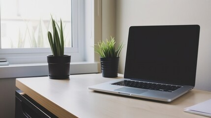 Fototapeta premium Laptop on a Desk with Plants and Window